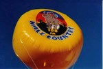 helium advertising balloon in disk shape and yellow color. USA made advertising balloons